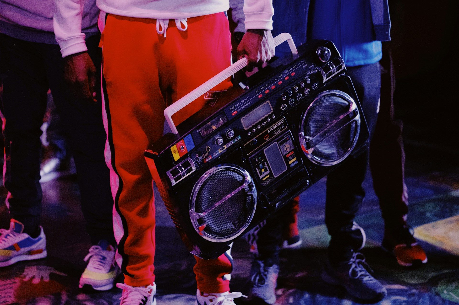An image of hip hop heads carrying a boombox.