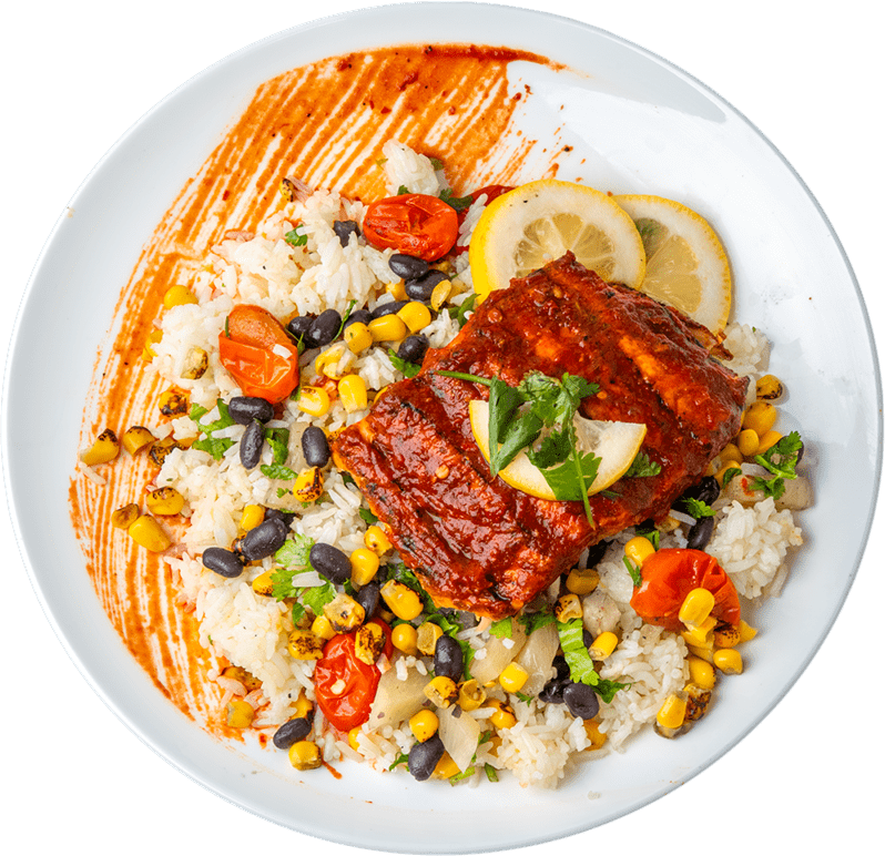 An image of a plate of salmon, rice, and veggies
