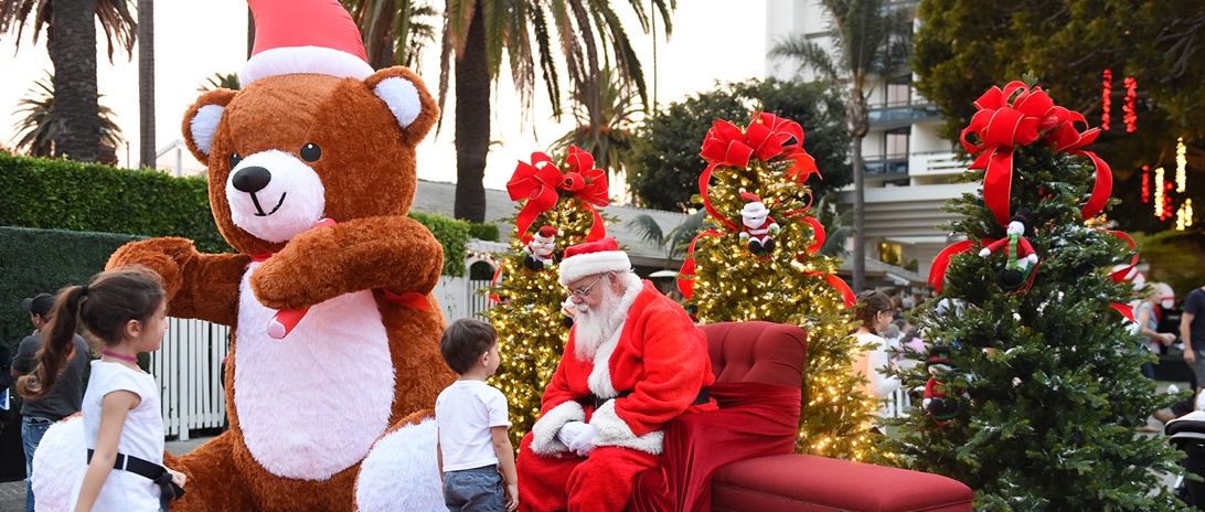 An image of kids posing with Santa Claus