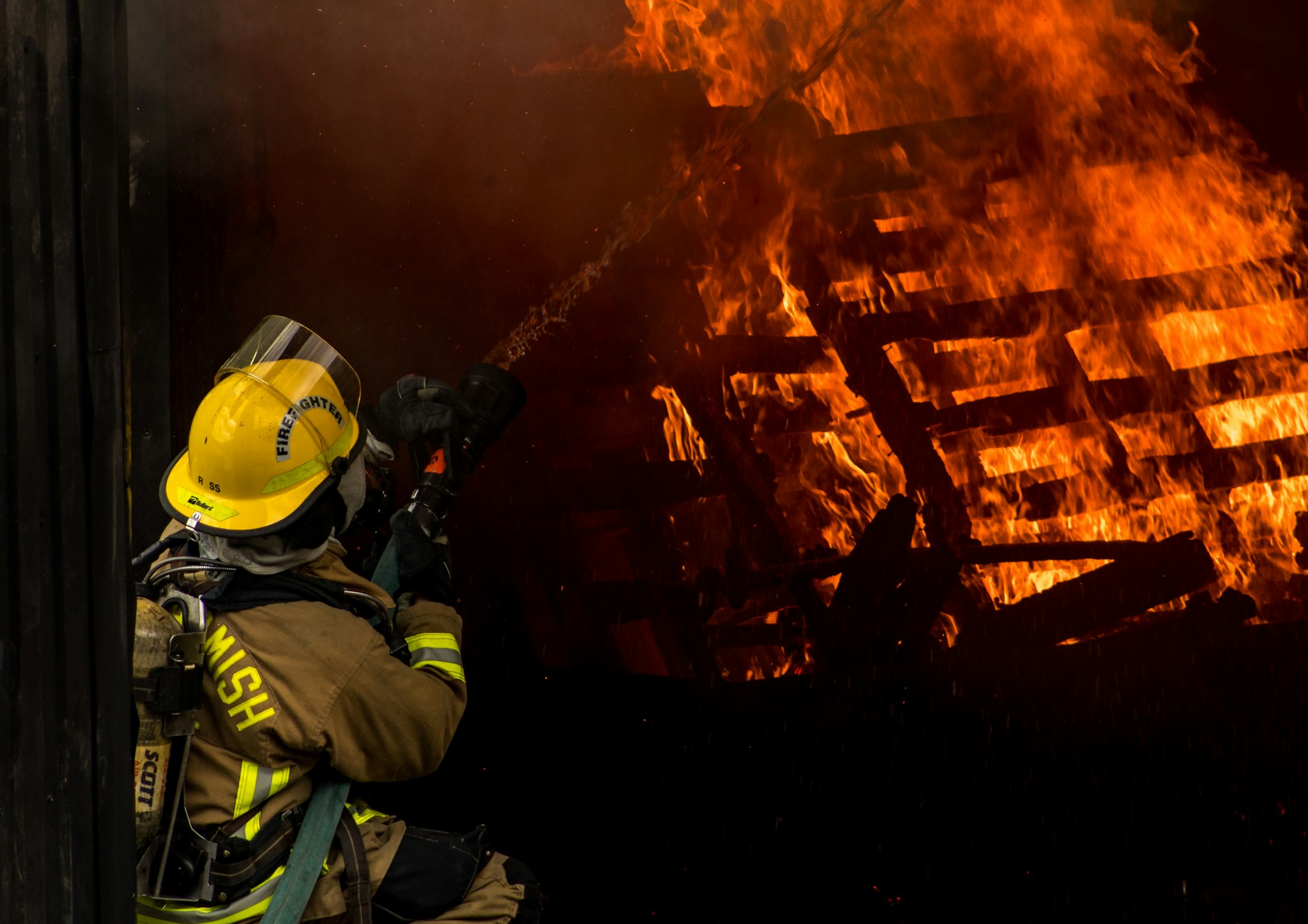 An image of a firefighter putting out a fire.
