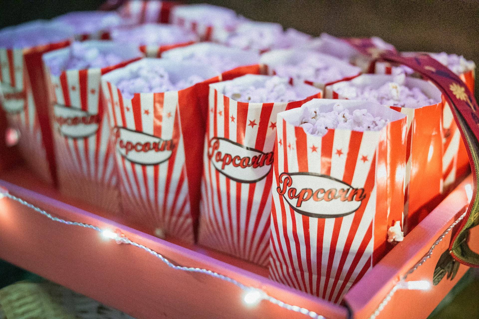 An image of a box filled with bags of popcorn.