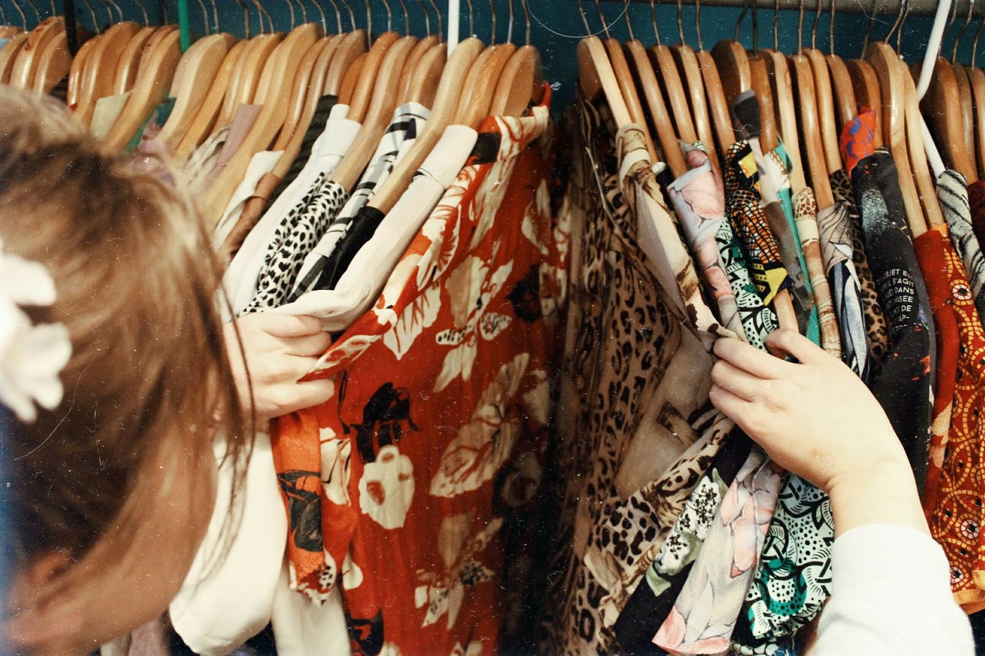 An image of someone vintage clothes shopping.