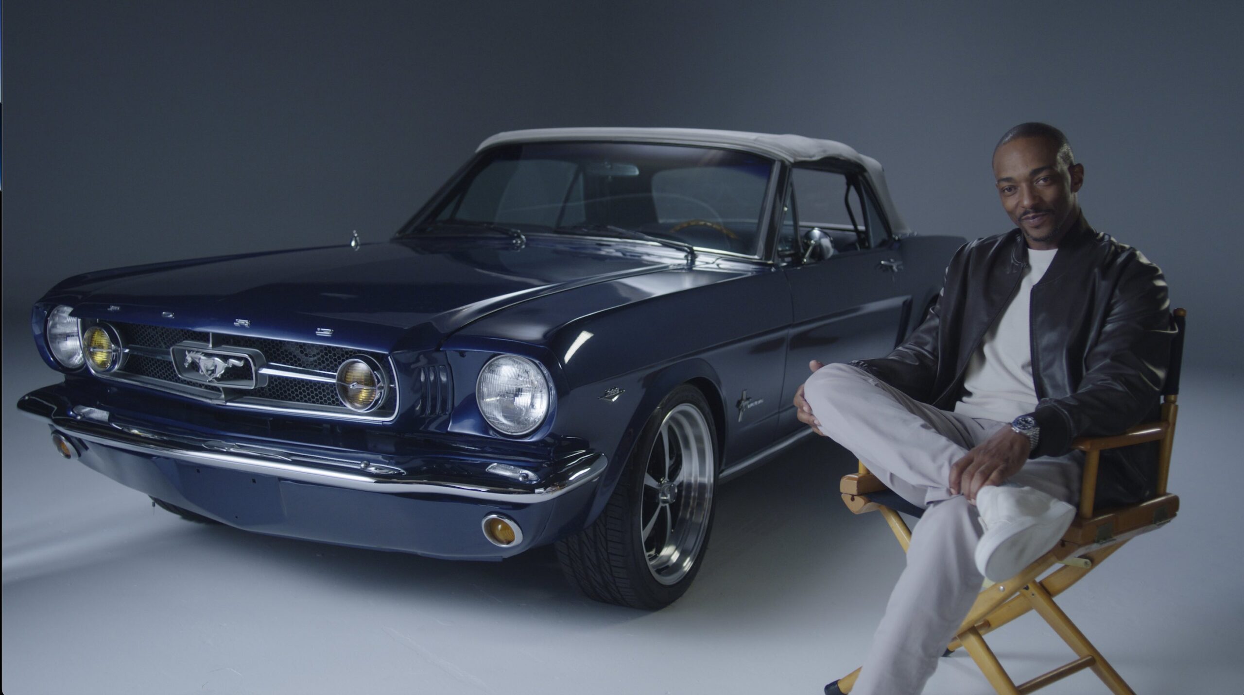 An image of a Ford Mustang and Anthony Mackie.