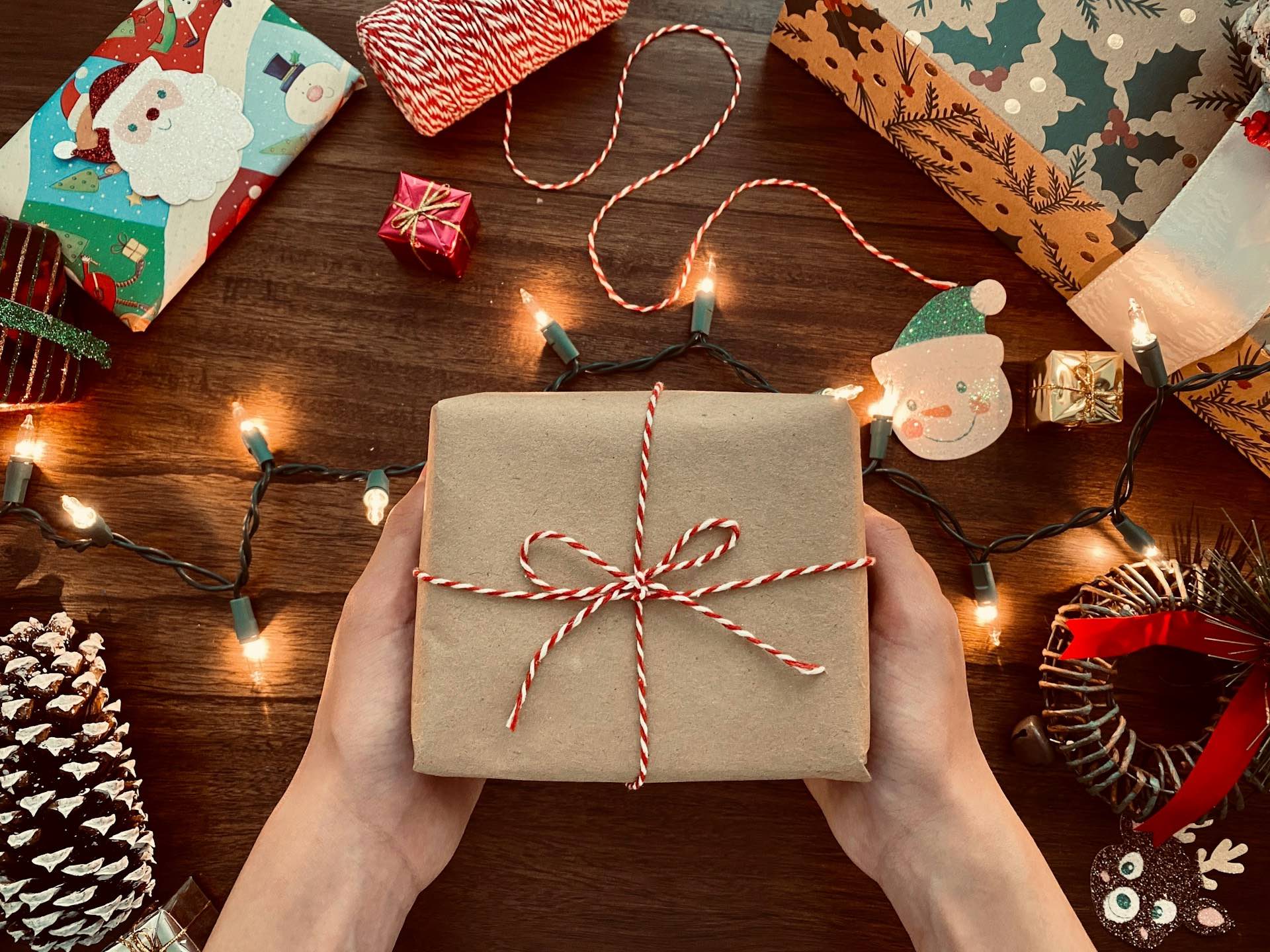 An image of someone holding a Christmas gift