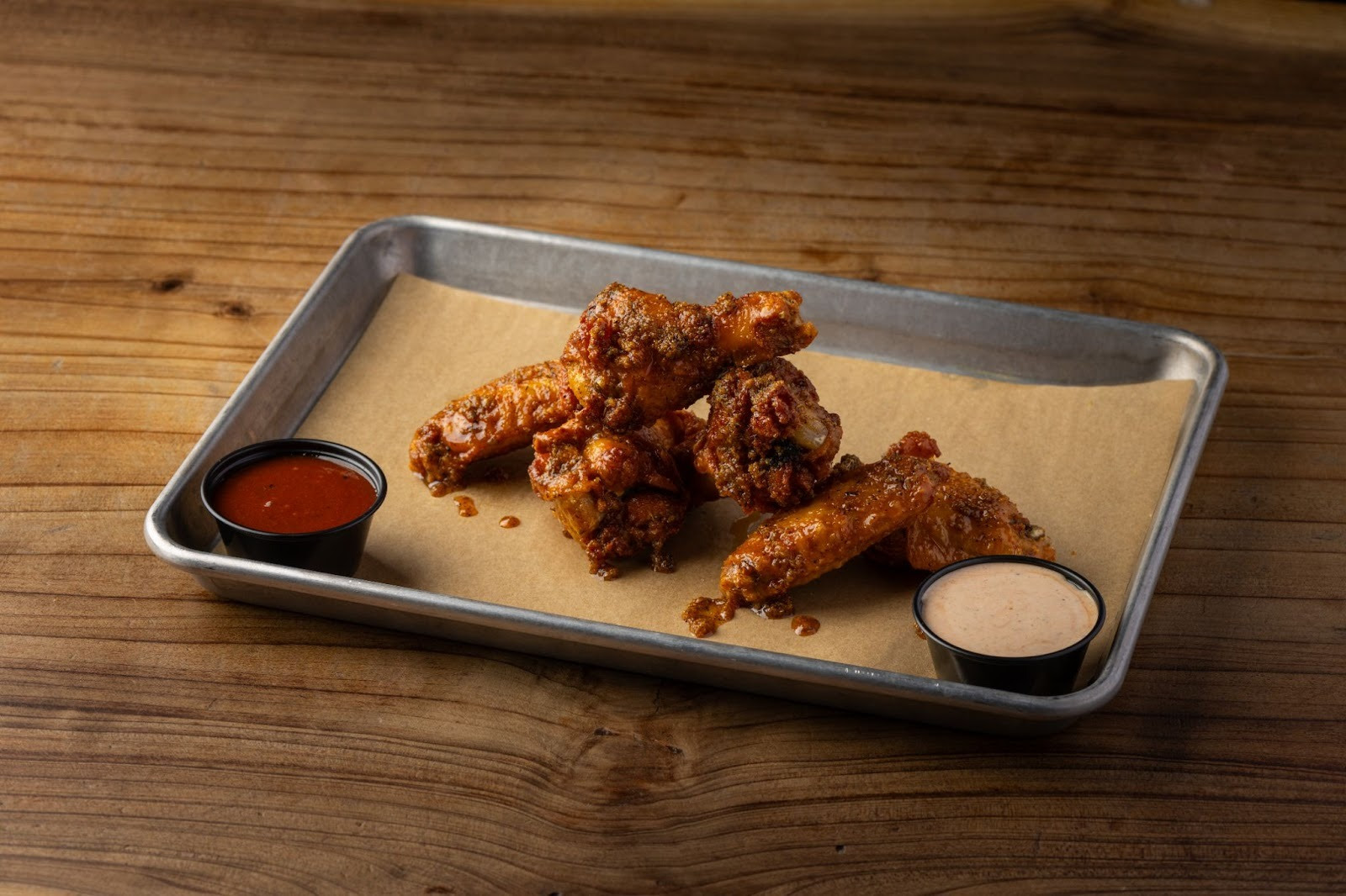 An image of a tray of AC Barbeque   wings.