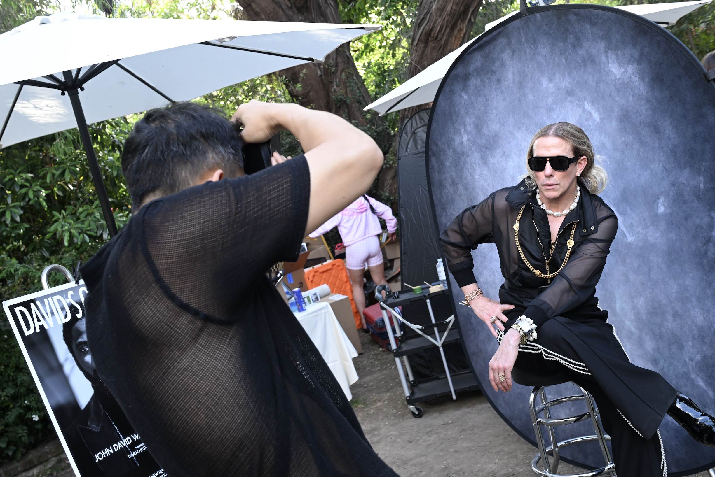 Derek Warburton poses n a pop-up portrait studio with celebrity photographer David Christopher Lee.