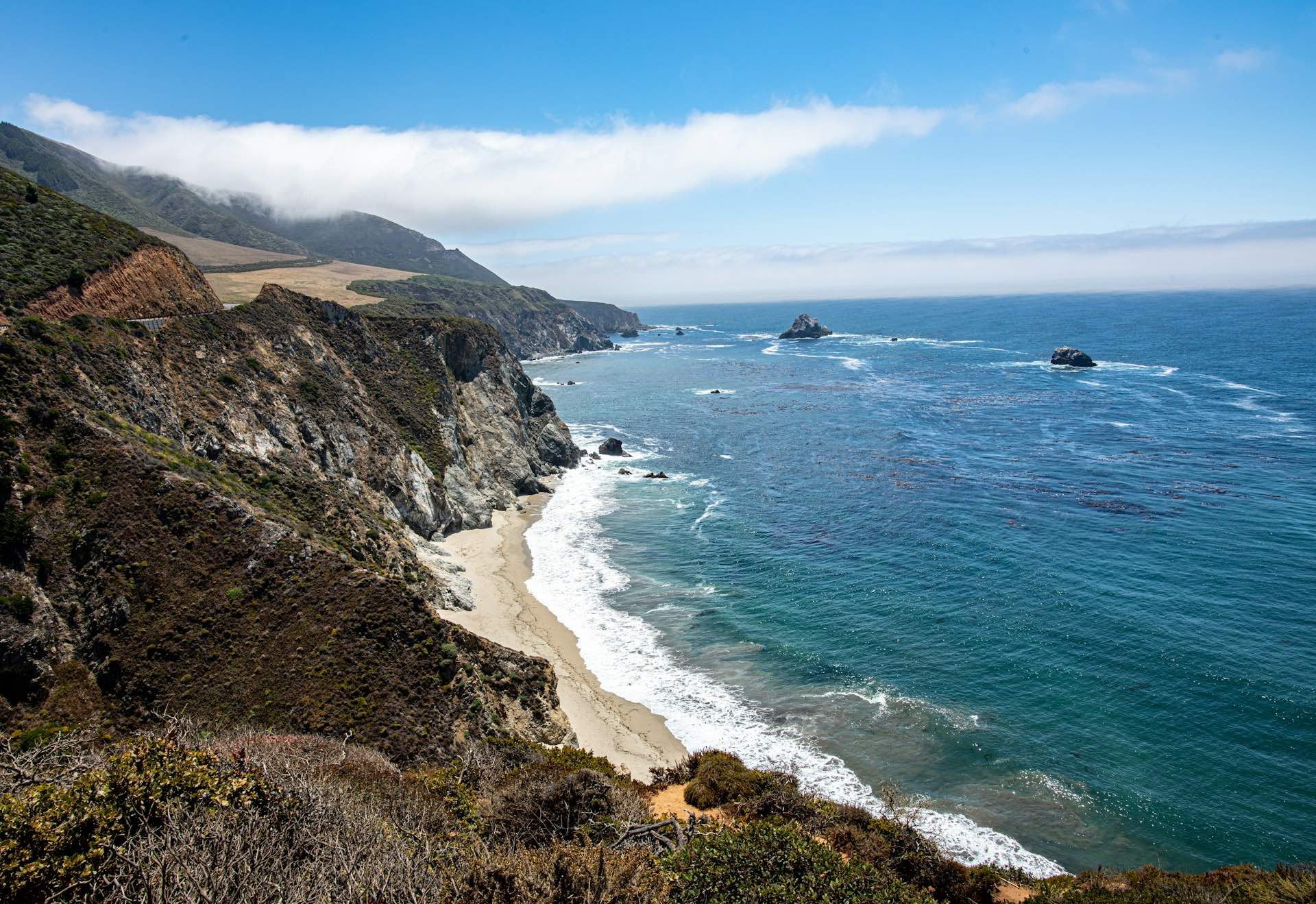 An image of the beach and cliff in Monterey, California.