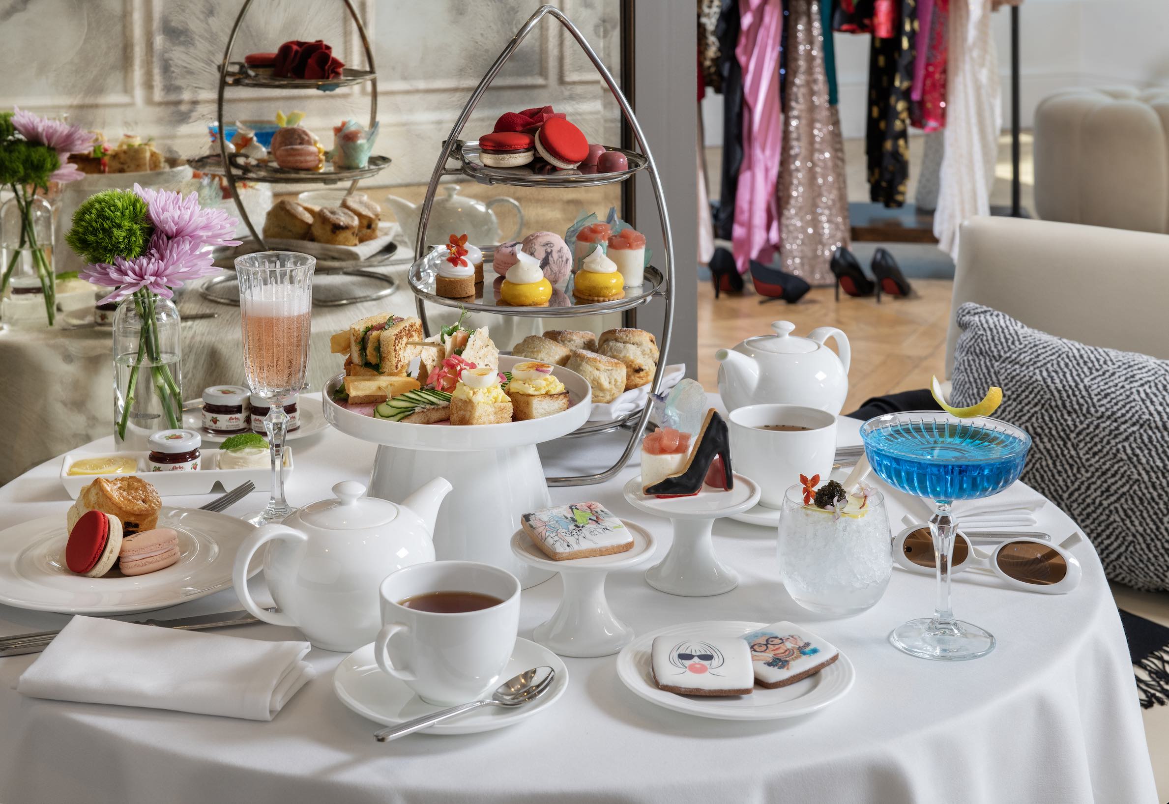 An image of the spread from The Devil Sips Tea: The Runway Collection, an afternoon tea inspired by the upcoming movie, The Devil Wears Prada 2.