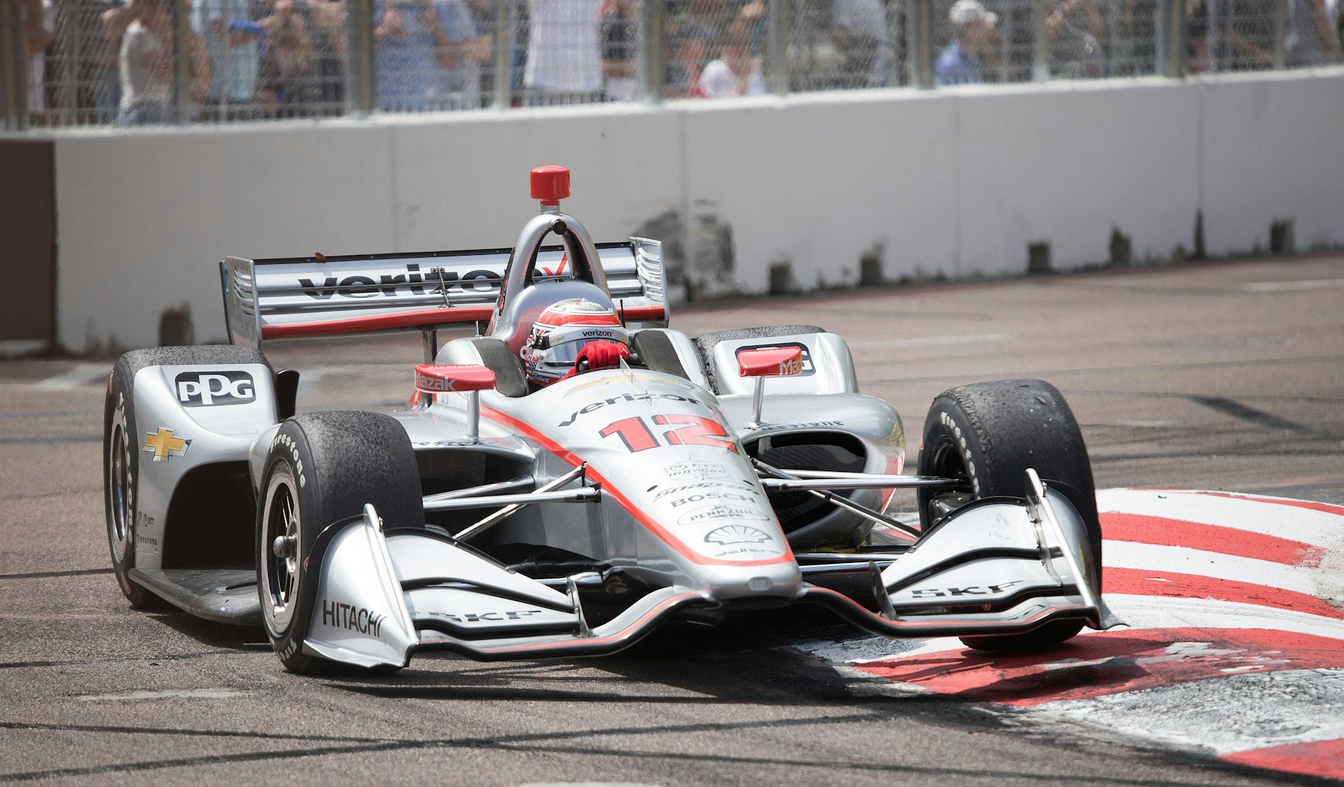An image of a race car at a Grand Prix race.