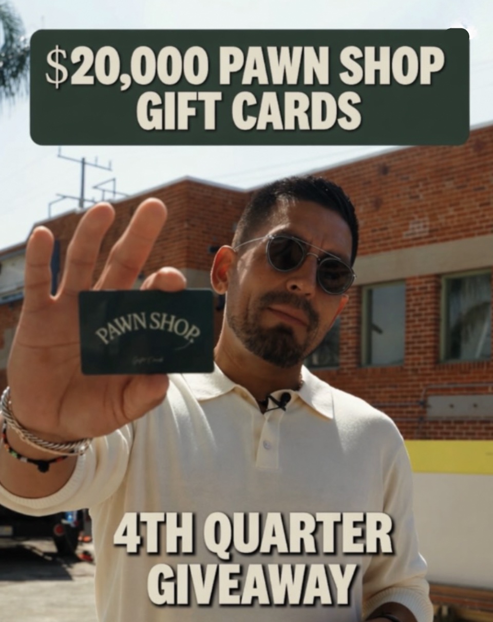 An image of a man holding a Pawn Shop gift card.