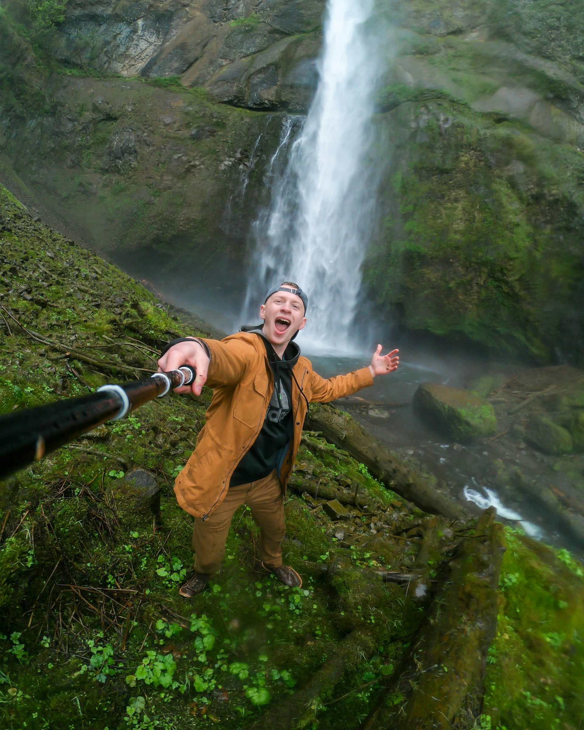 An image of a man holding a gopro.