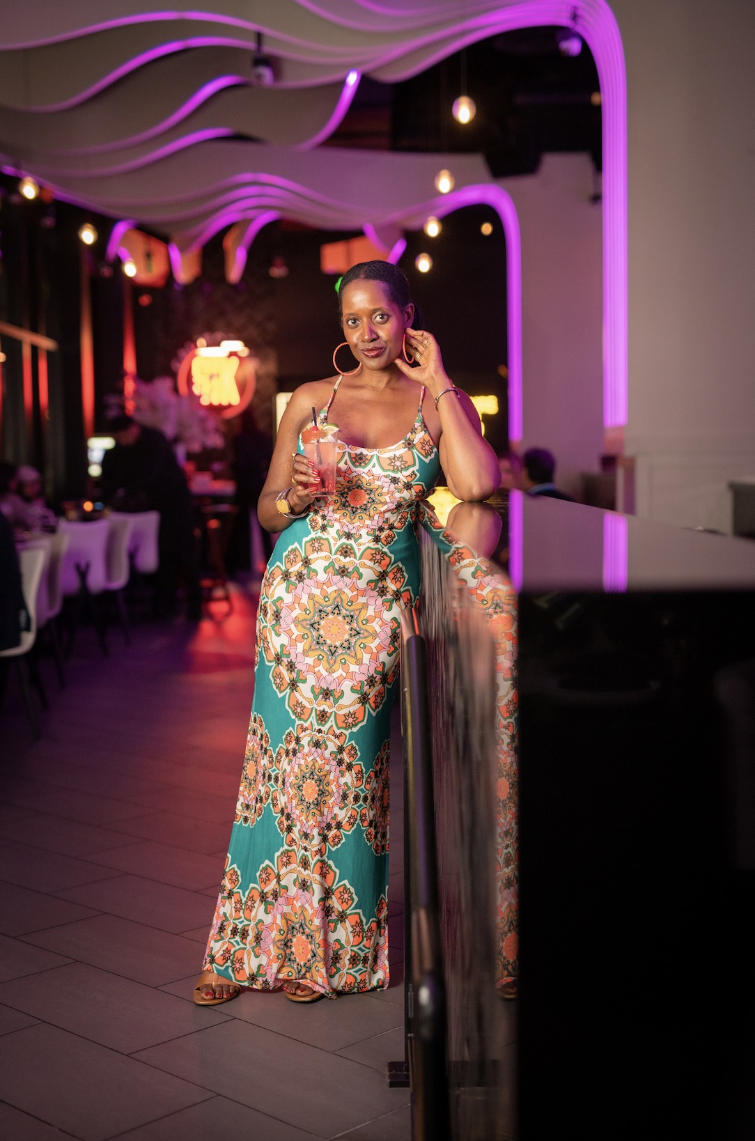 An image of lifestyle blogger Ariel Johns at STK holding a Pantalones cocktail - the Moonlit Ranch Water.
