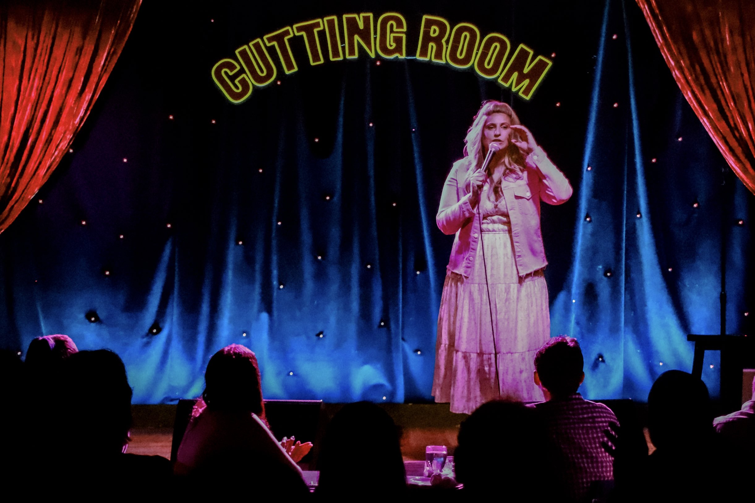 An image of Comedian Chanel Omari on stage at The Cutting Room in New York City for her live comedy special over Memorial Day Weekend