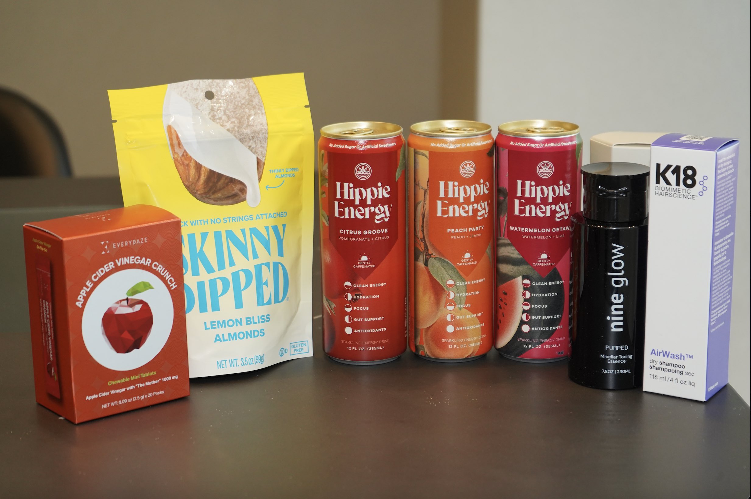 An image of products from Everydaze, SkinnyDipped, Nine Glow, and K18 Hair. 