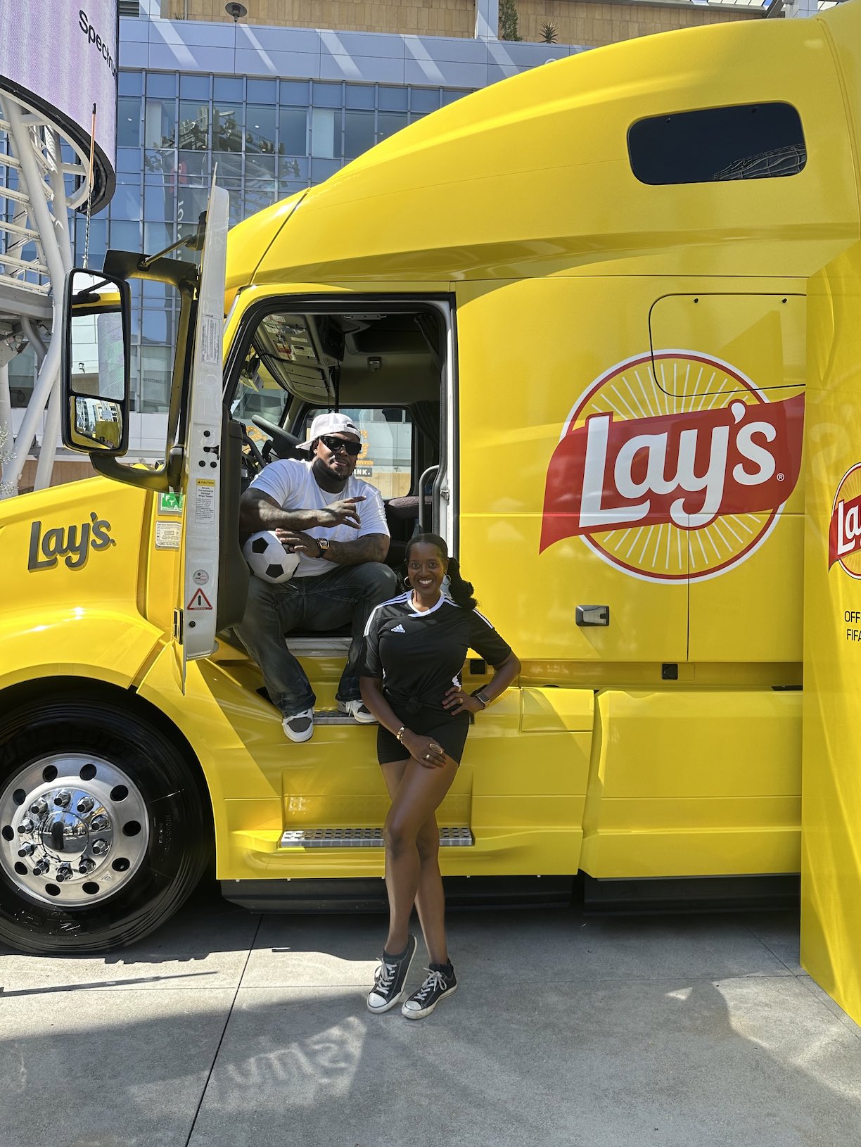 An image of lifestyle blogger Ariel Johns with Marshawn Lynch.