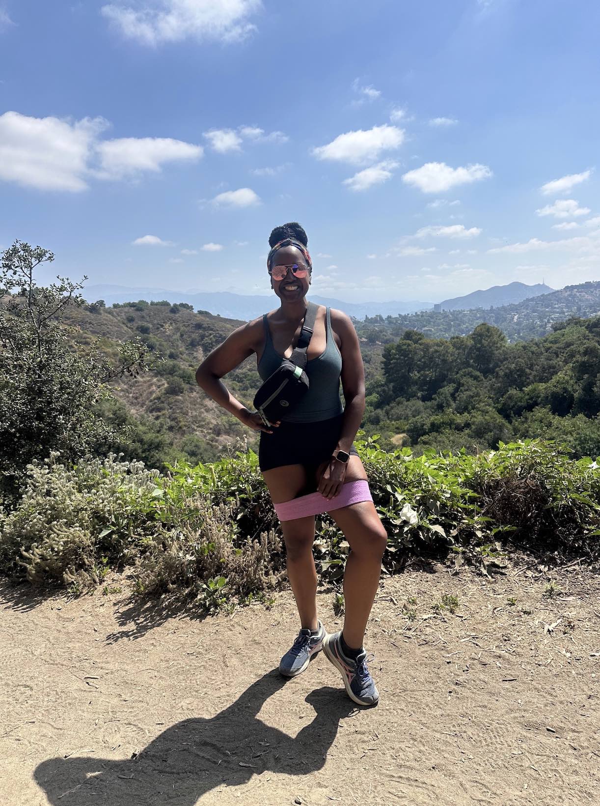 An image of lifestyle blogger Ariel Johns hiking at Fryman Canyon wearing resistance bands.