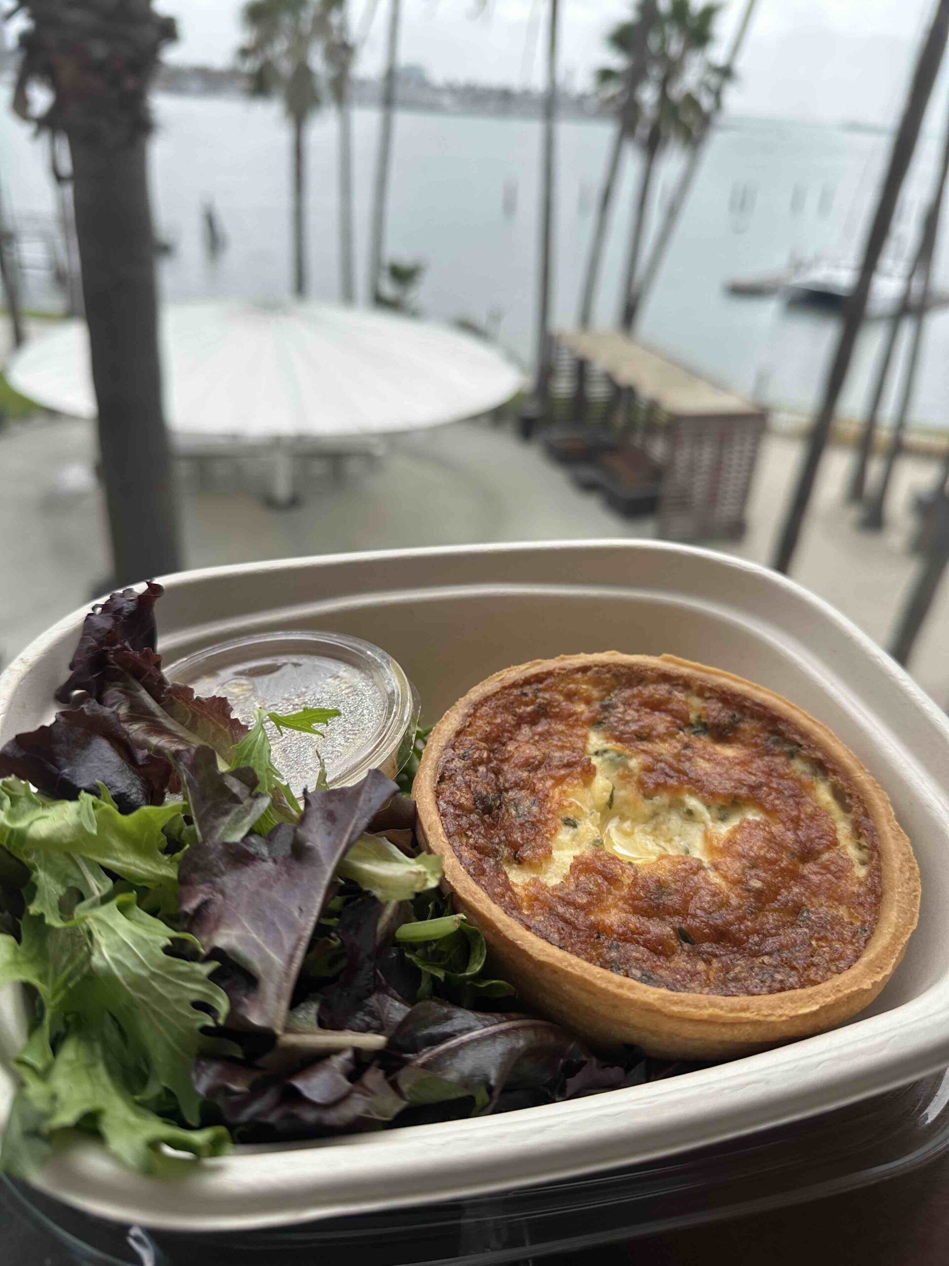 An image of a quiche and salad from The new Café de Fuego.