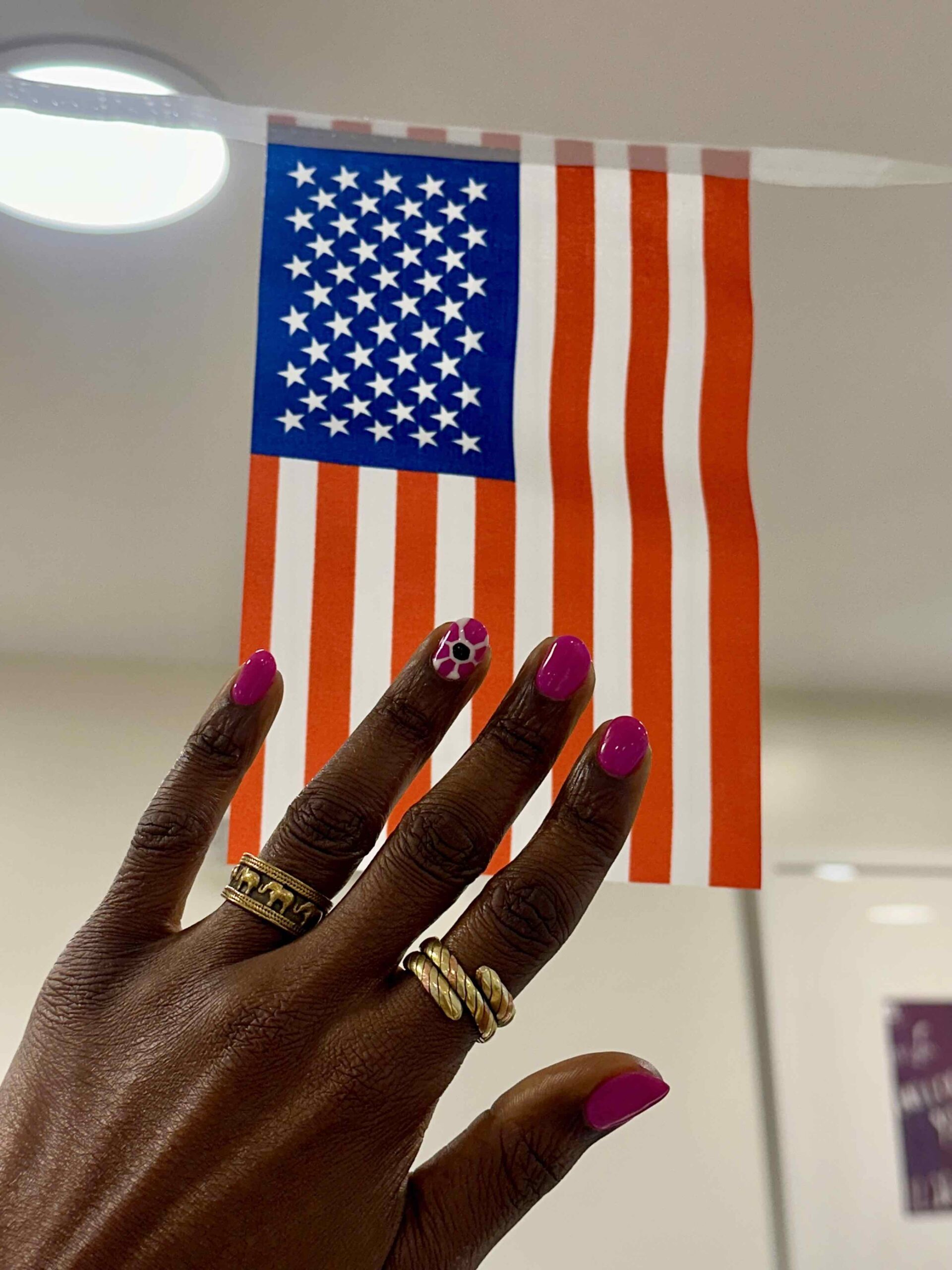 An image of my summer nails with World Cup nail art from MiniLuxe in front of an American FLag.
