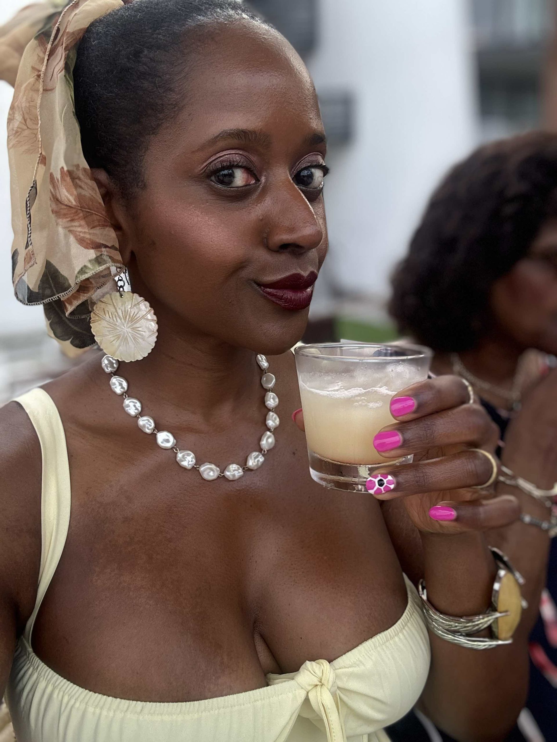An image of lifestyle blogger Ariel Johns holding a tequila cocktail at Fuego.