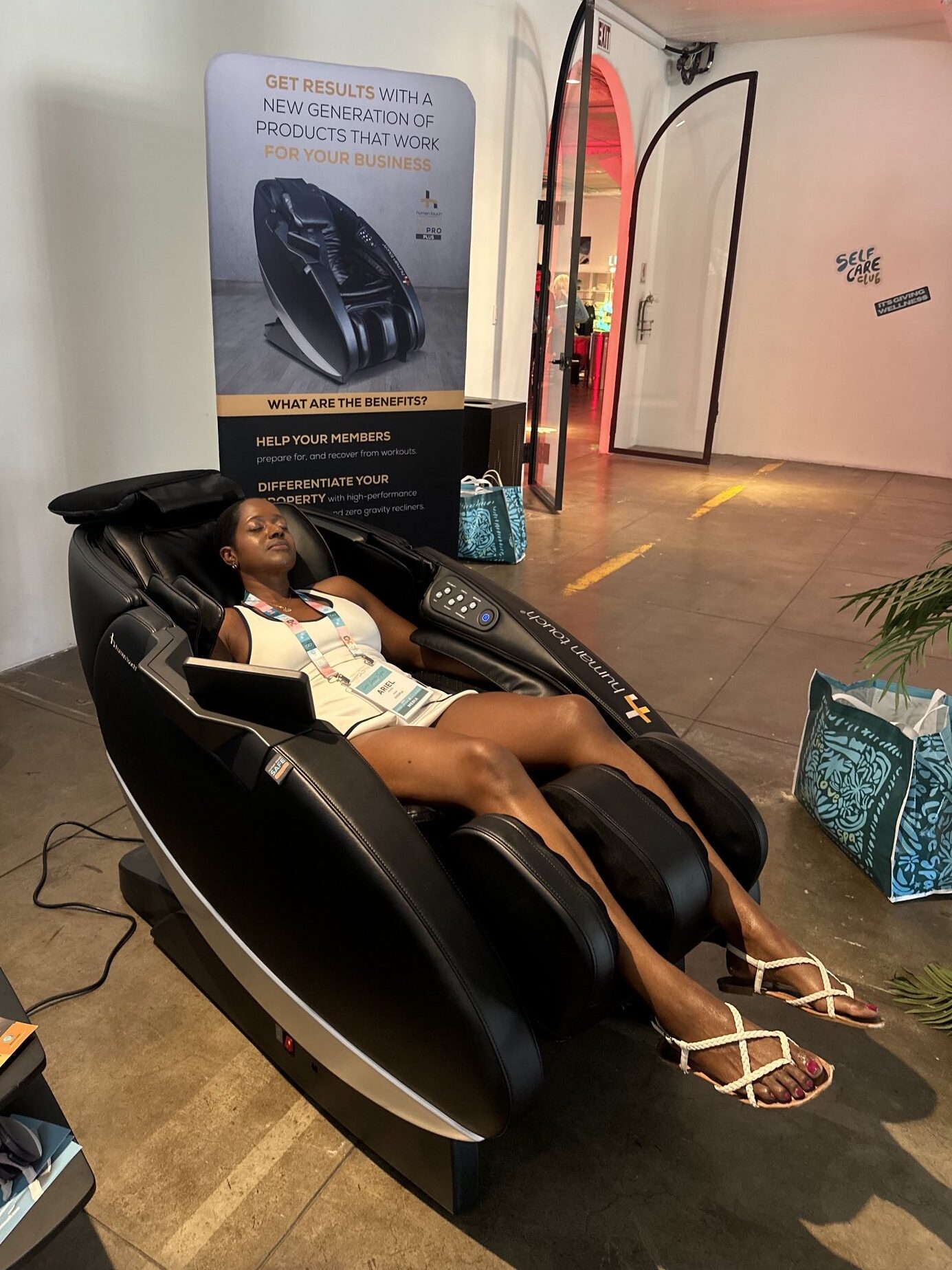 An image of lifestyle blogger Ariel Johns in the Human Touch Massage Chair.