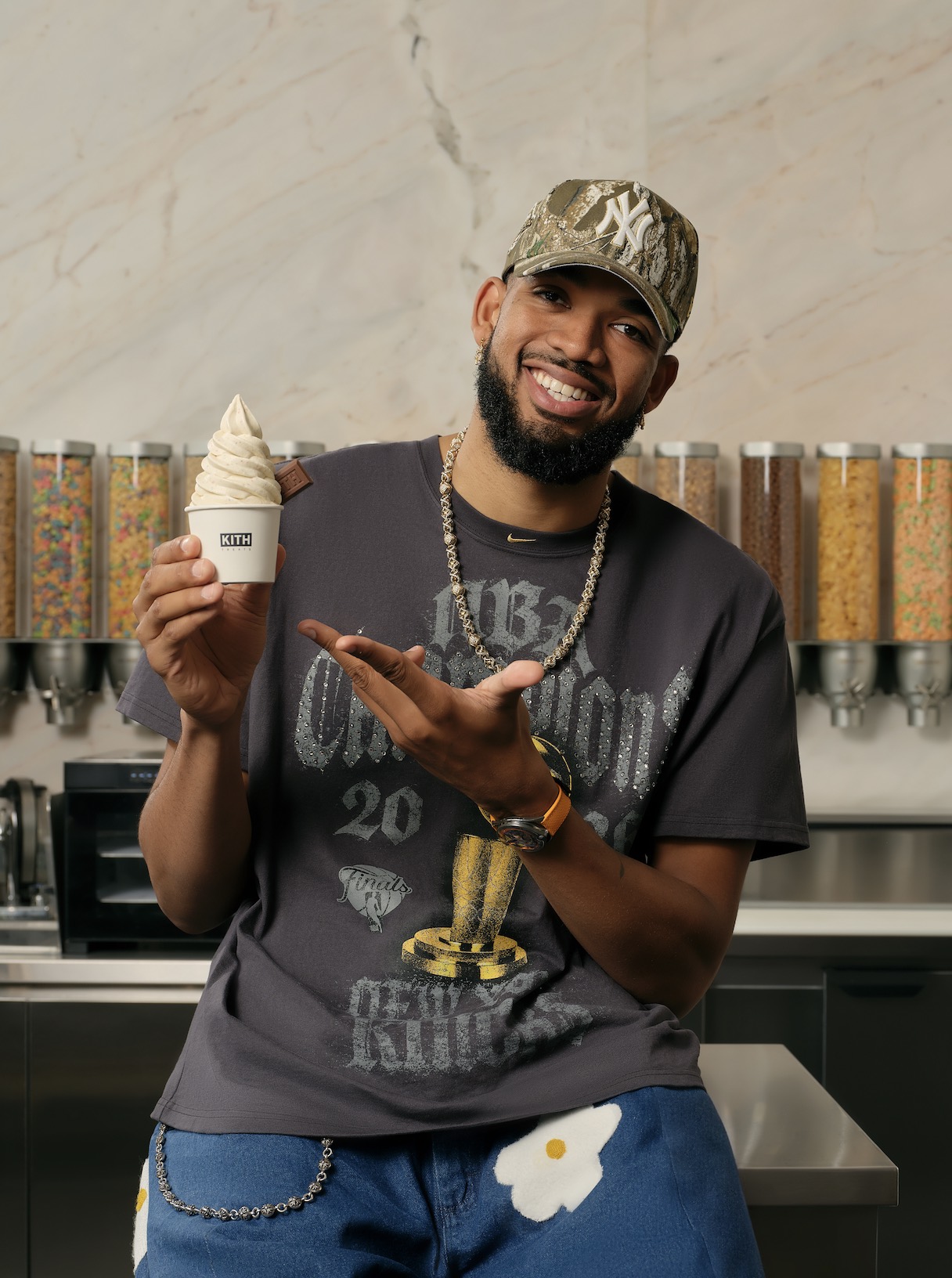 An image of NBA Champion Karl-Anthony Towns holding the Off-Season ice cream at Kith Treats