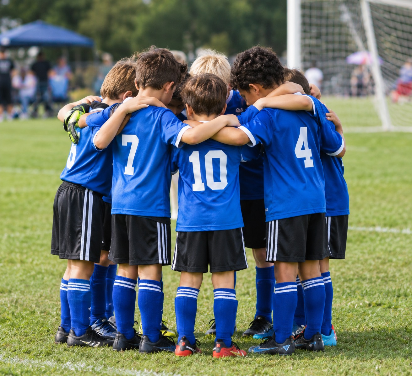 An image of a youth soccer team in a huddle