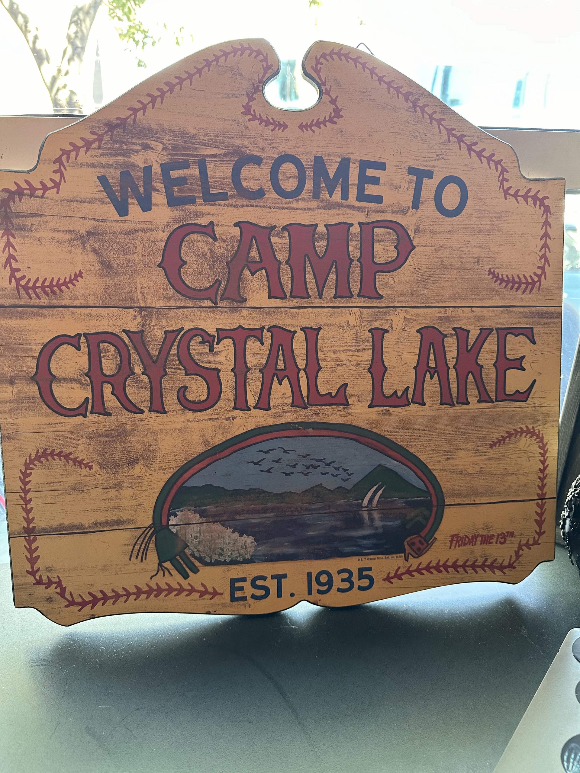An image of the sign for Camp Crystal Lake.